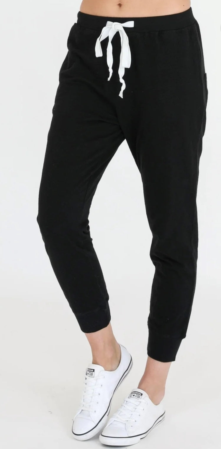 Black cotton joggers with white drawstring